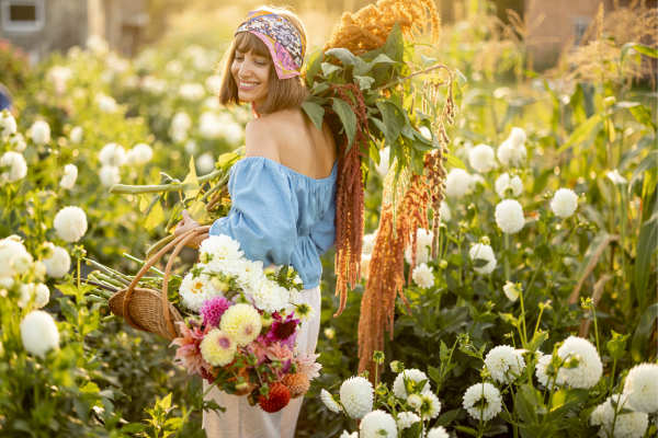 woman holding flowers in a field
